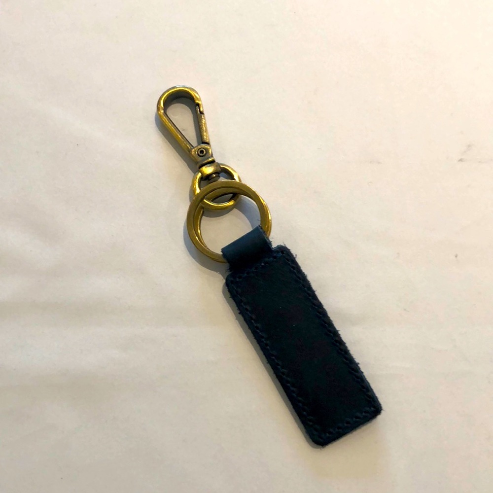 Blue leather key holder with brass hardware